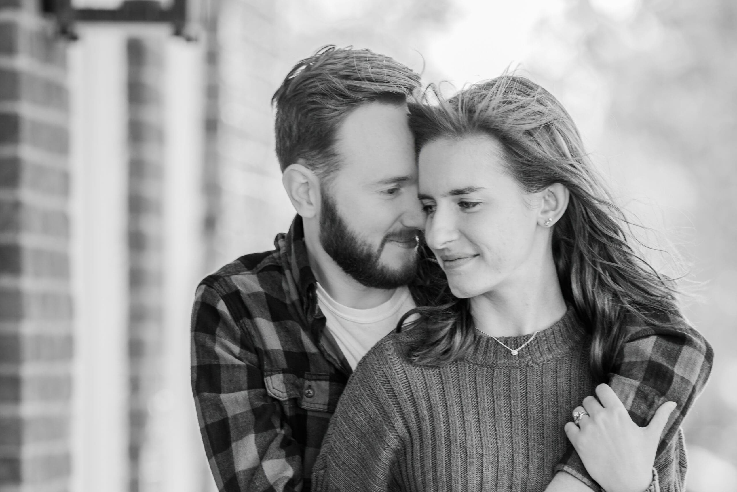 A black and white image of a couple tenderly embracing, taken in Delafield, Wisconsin, by Laura Lu Photography.